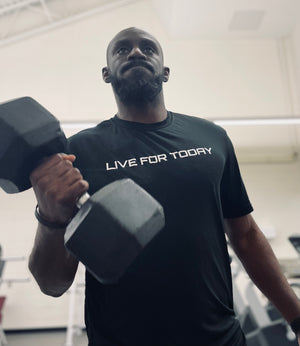 Open image in slideshow, man lifting in black performance tee
